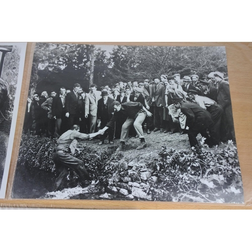 570 - An interesting lot of black and white movie stills photos including two featuring scenes from The Qu... 