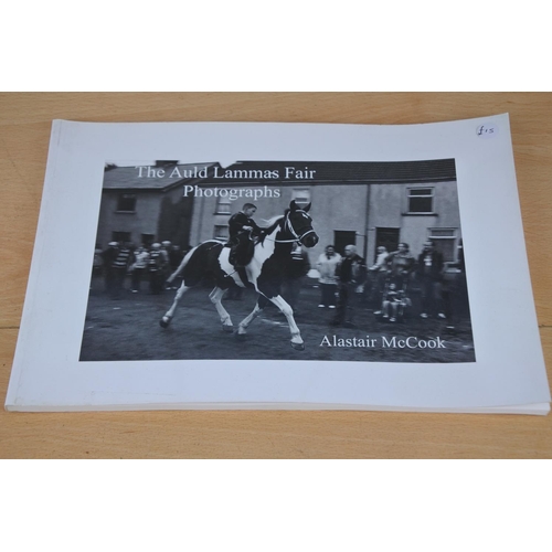 593 - A signed copy of The Auld Lammas Fair Photographs by Alastair McCook.