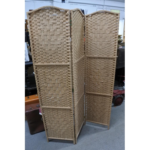 595 - A three fold rattan screen Each panel approx 40x170cm