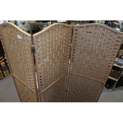 595 - A three fold rattan screen Each panel approx 40x170cm