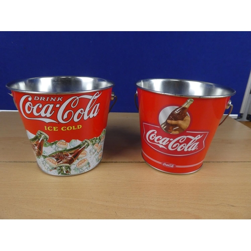 601 - Two metal Coca Cola buckets.