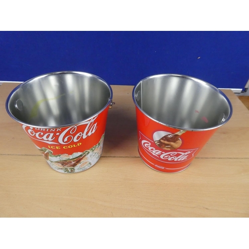 601 - Two metal Coca Cola buckets.