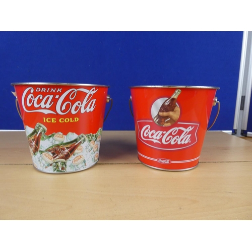 601 - Two metal Coca Cola buckets.