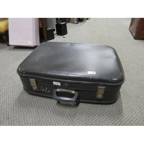 604 - A vintage suitcase.