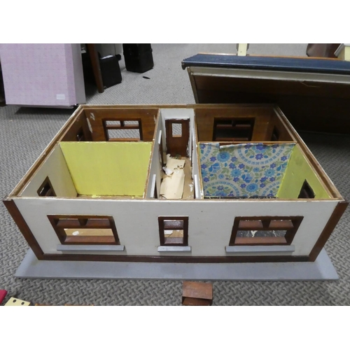 614 - A wooden dolls house. Approx 70x40x60cm.