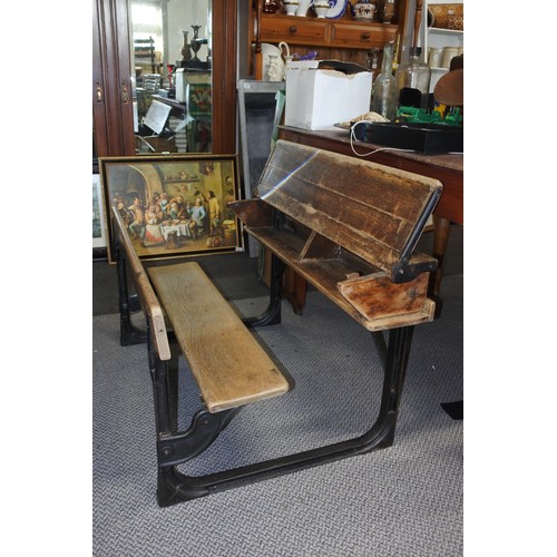 587 - A stunning antique pine school desk with cast iron frame, measuring 92cm x 52cm x 65cm approximately... 