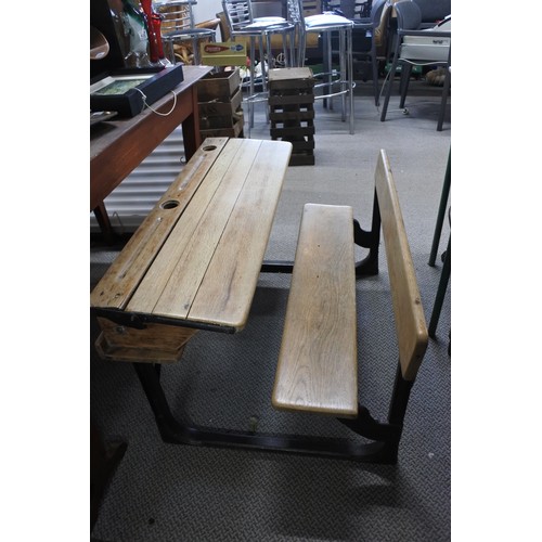 587 - A stunning antique pine school desk with cast iron frame, measuring 92cm x 52cm x 65cm approximately... 