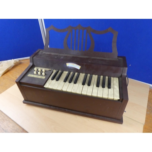 58 - A vintage Mont Petit child's organ.