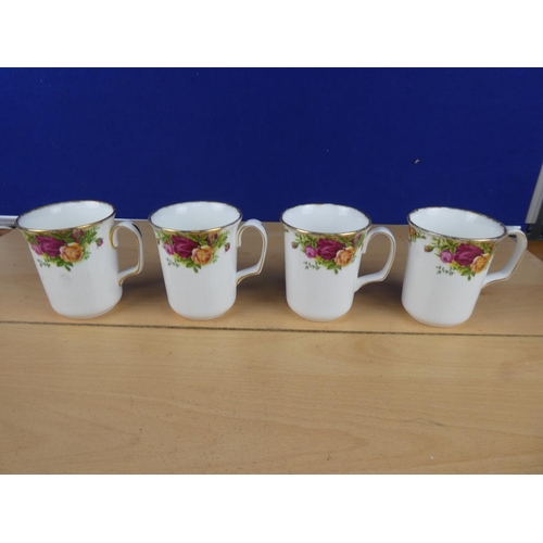 73 - Four Royal Albert Old Country Rose mugs.