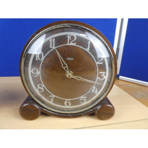 75 - A vintage Metamec mantle clock and another.