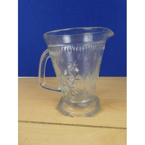 93 - A vintage pressed glass water jug.