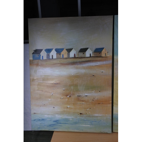 213 - A pair of beach scene pictures, each measuring 49cm x 69cm approximately.