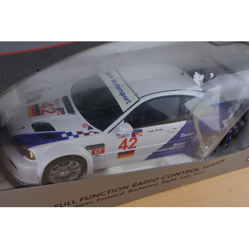 214 - A boxed Mjxric full function radio control series car, scale 1:10.