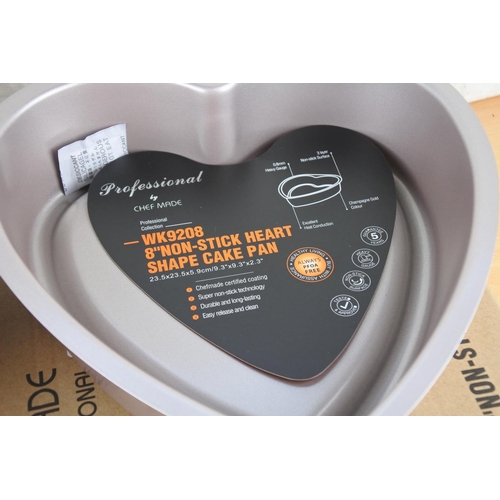 217 - Two boxed heart shaped baking tins.