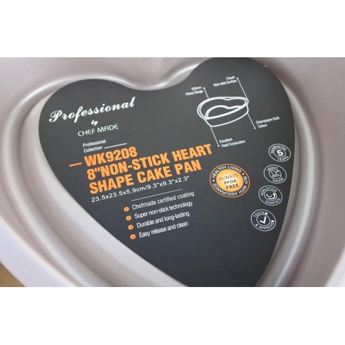 229 - Two boxed heart shaped baking tins.