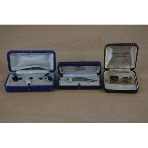 241 - A vintage cased D R Dingwall Ltd 'L' tiepin, a cased set of gold plated cufflinks and more.