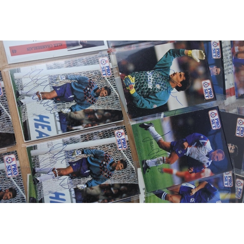 243 - A large lot of collectors football cards with signatures.