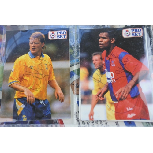 243 - A large lot of collectors football cards with signatures.