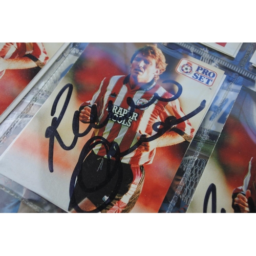 243 - A large lot of collectors football cards with signatures.