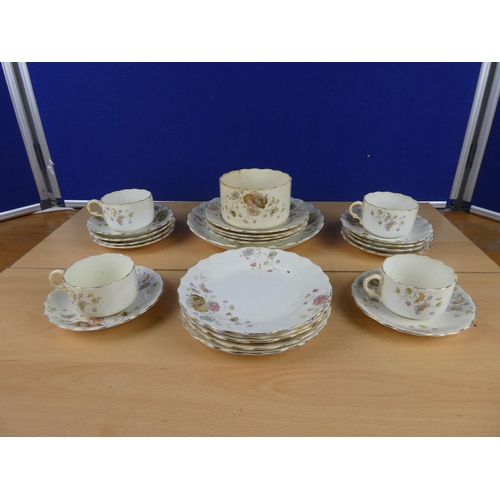 113 - An antique floral pattern part tea set.