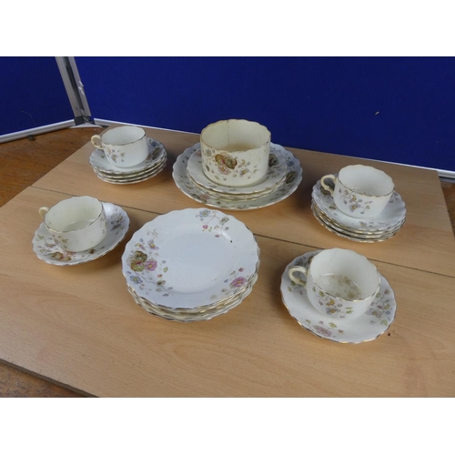 113 - An antique floral pattern part tea set.