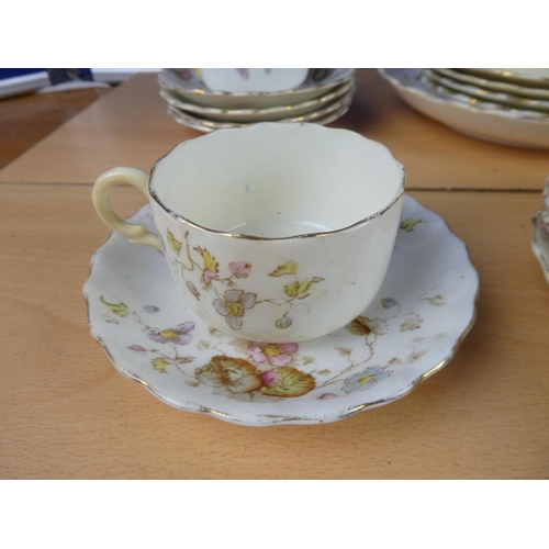 113 - An antique floral pattern part tea set.