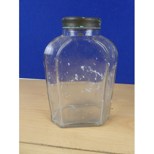 131 - A vintage glass jar with brass lid, measuring 22cm in height.