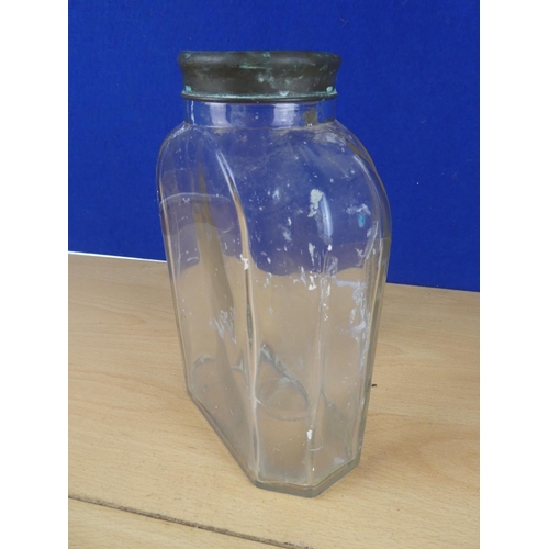 131 - A vintage glass jar with brass lid, measuring 22cm in height.