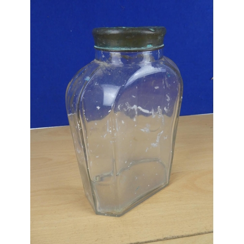 131 - A vintage glass jar with brass lid, measuring 22cm in height.