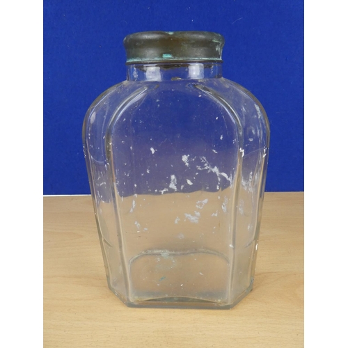 131 - A vintage glass jar with brass lid, measuring 22cm in height.