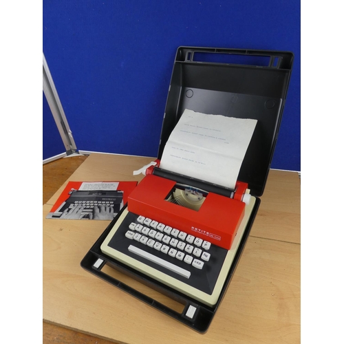 138 - A cased Petite childs typewriter.