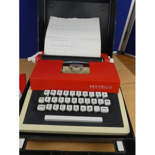 138 - A cased Petite childs typewriter.