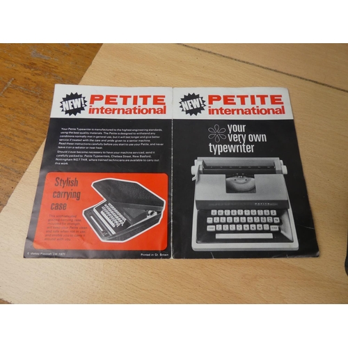 138 - A cased Petite childs typewriter.