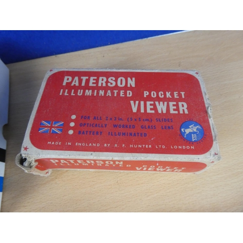 156 - A vintage boxed Paterson Illuminated Pocket Viewer, camera film and more.