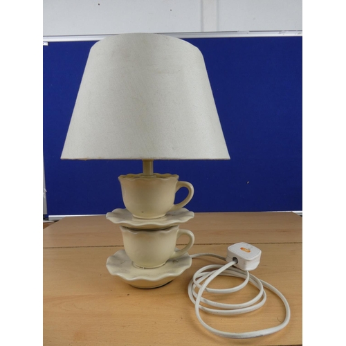 168 - An unusual pottery table lamp and shade, measuring 35cm in height.