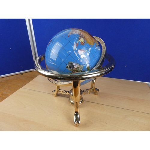 173 - A globe on stand, measuring 34cm in height.