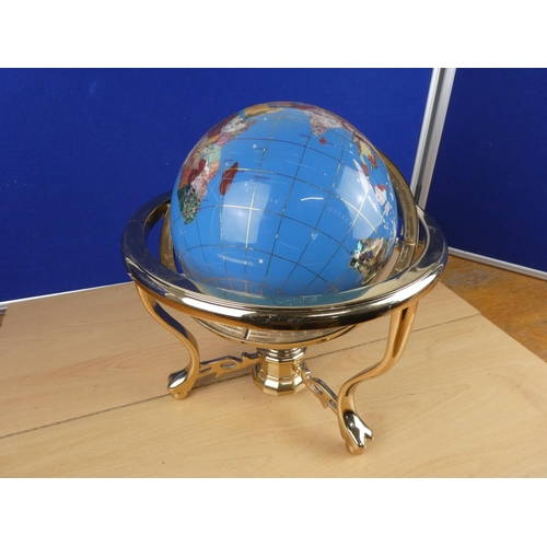 173 - A globe on stand, measuring 34cm in height.