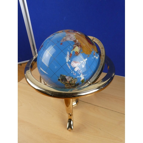 173 - A globe on stand, measuring 34cm in height.