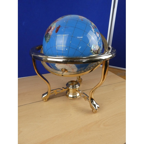 173 - A globe on stand, measuring 34cm in height.