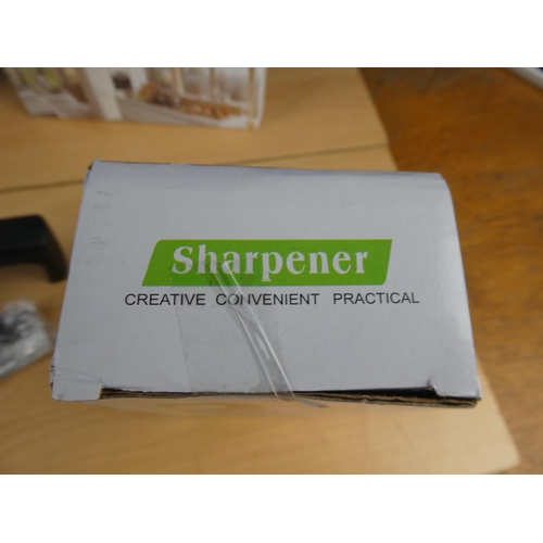 181 - Five boxed knife sharpeners.