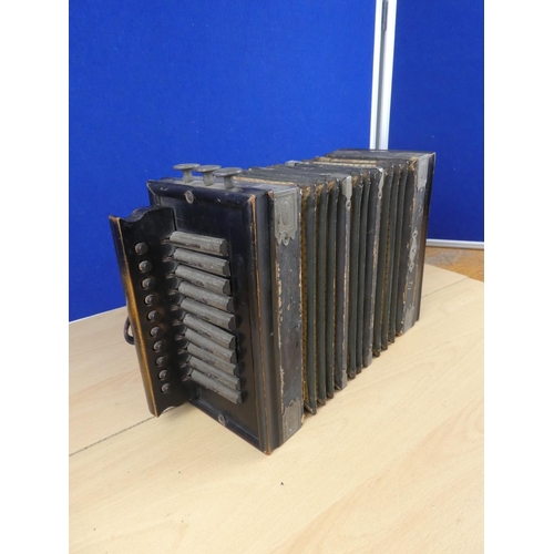 186 - An antique small accordion.