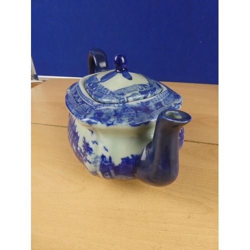 193 - An antique blue and white ceramic teapot.