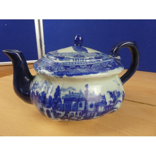 193 - An antique blue and white ceramic teapot.