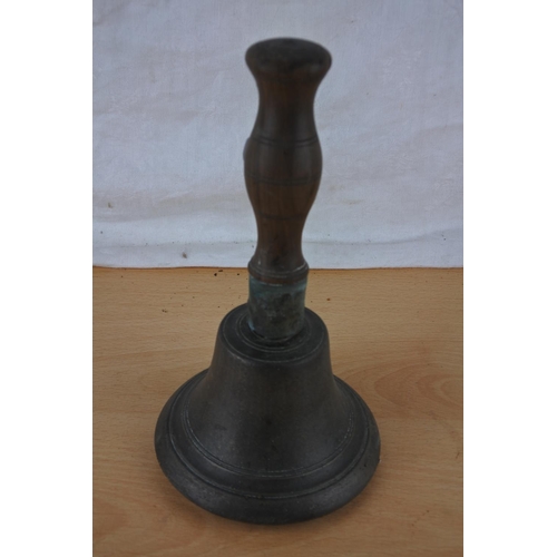 517 - An antique wood handled school bell.