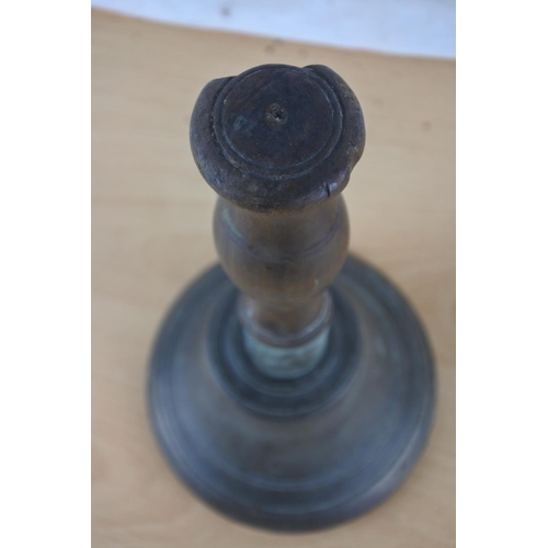 517 - An antique wood handled school bell.