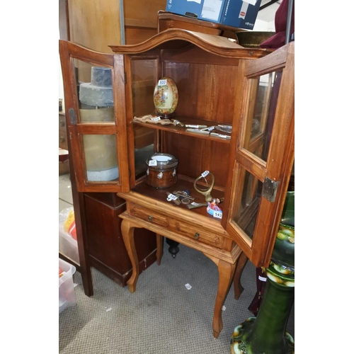 532 - A pine small two door display cabinet with drawer, measuring 60cm x 135cm x 30cm.