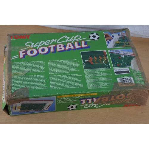 65 - A boxed vintage Tomy Super Cup Football game.