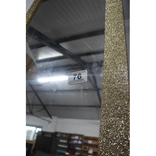 76 - A framed wall mirror, measuring 37x50cm approximately.