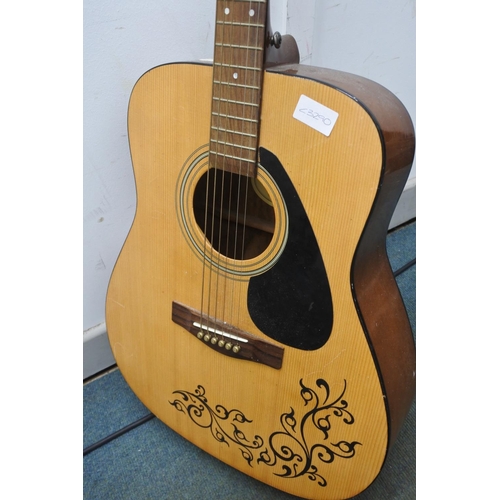 84 - A Yamaha acoustic guitar.