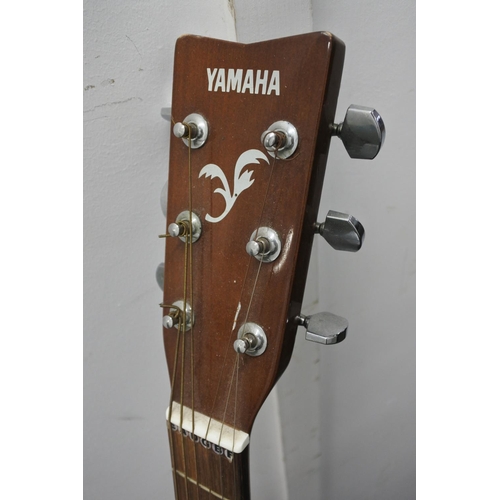 84 - A Yamaha acoustic guitar.